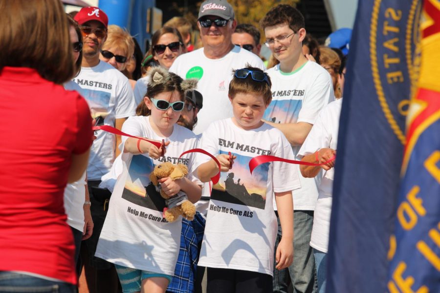 The cutting of the ribbon signified the beginning of the walk. Teams had been announced and the total amount of money raised had been tallied with promises the more was coming in.
Photo by Isabel Johnson 