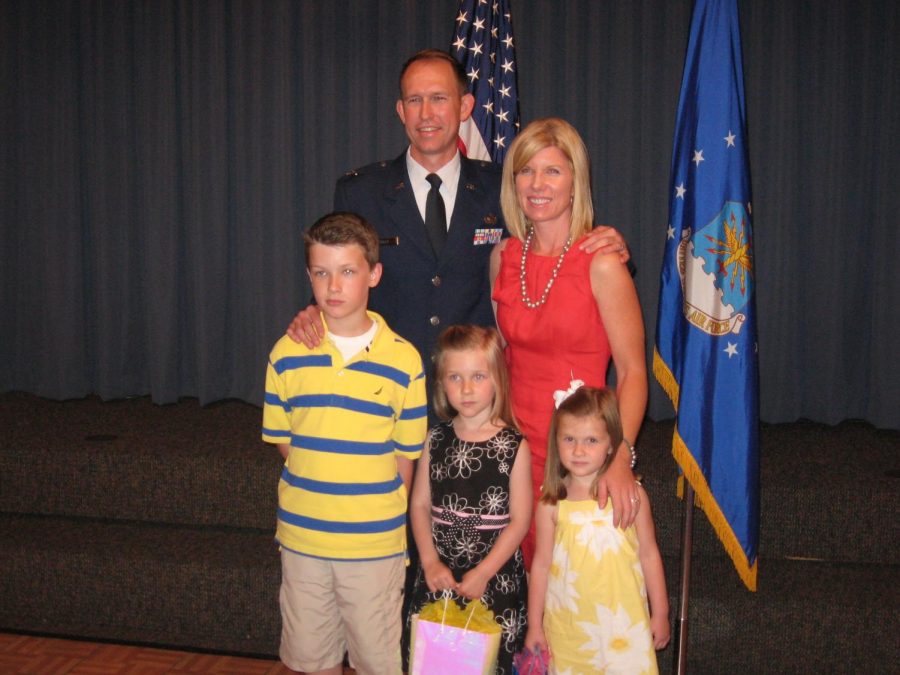 The Tracy family receiving the promotion to move to Colorado.