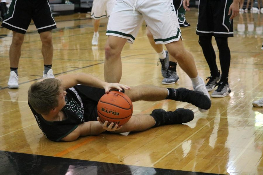 Junior Jacob Harmedierks going after the loose ball