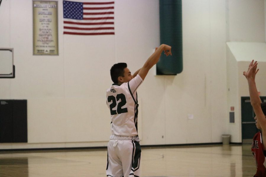 Sophomore Sam Meeves shooting a three-pointer in the 2nd quarter