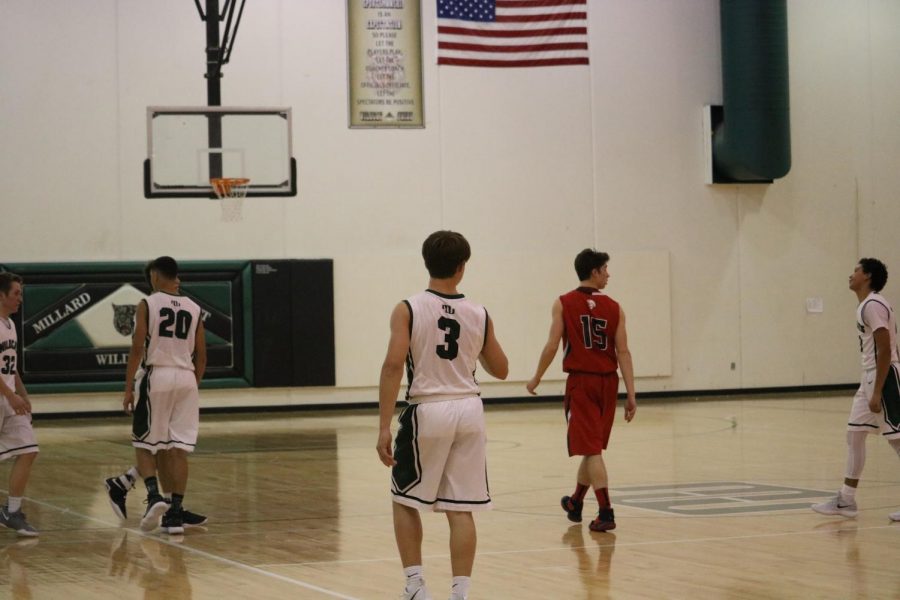 Sophomore Max Anderson walks down the court after forcing turnover