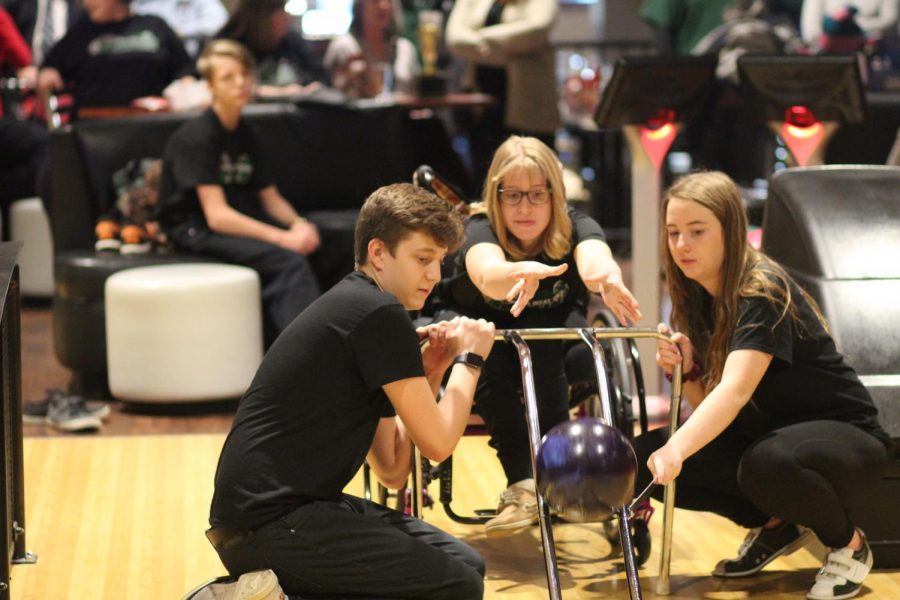 Unified Bowlers, junior Mason Fridrich, sophmore Olivia Lallman and junior Rebecca Hitz, compete during Districts. Fierce competetors like these students helped West take major strides this year. “It’s a lot of fun,”  Hitz said. “It’s just a great thing to be a part of.”