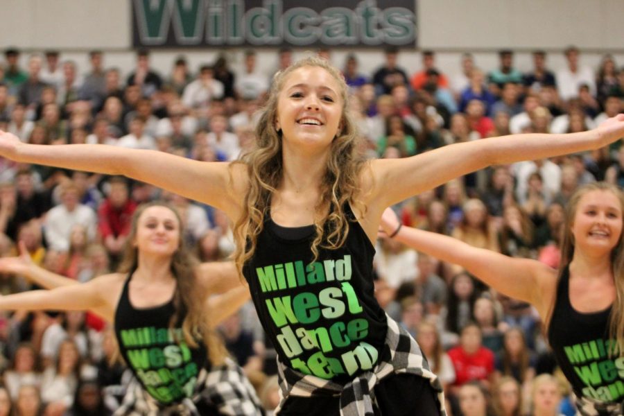 Senior Caroline Unger leads the dance team at an upbeat pep rally routine