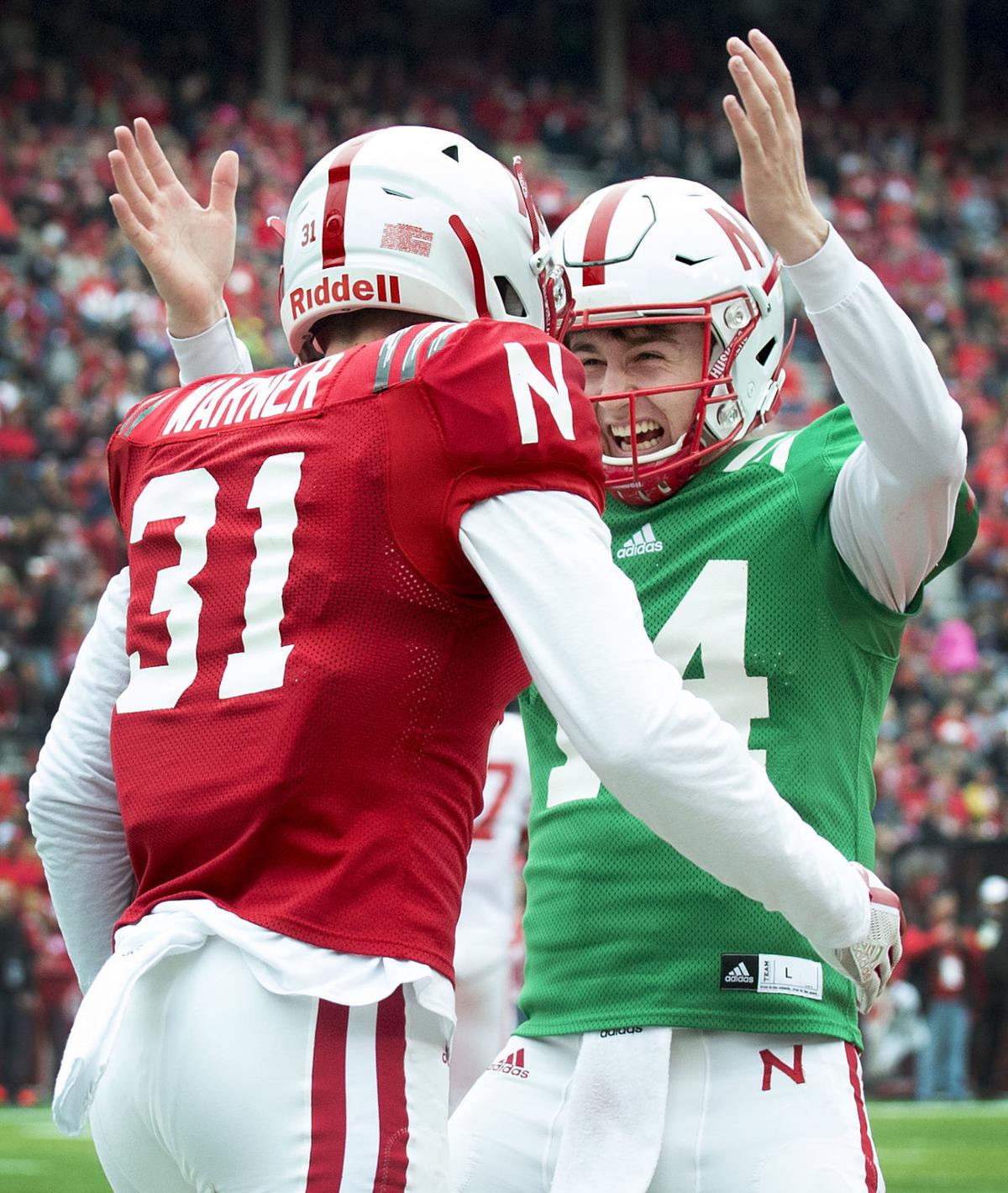 Kade Warner shares an embrace with Tristan Gebbia after a 57 yard touchdown pass. Photo by the Lincoln Journal Star.