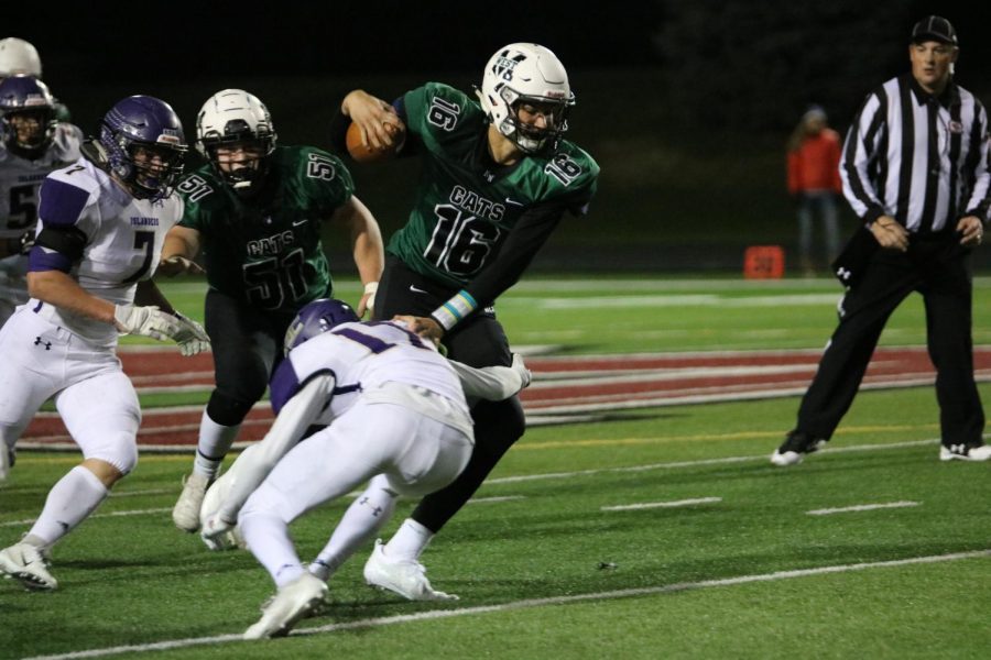 Junior quarterback Tristan Gomes fights for some extra yards in a game against Grand Island. 