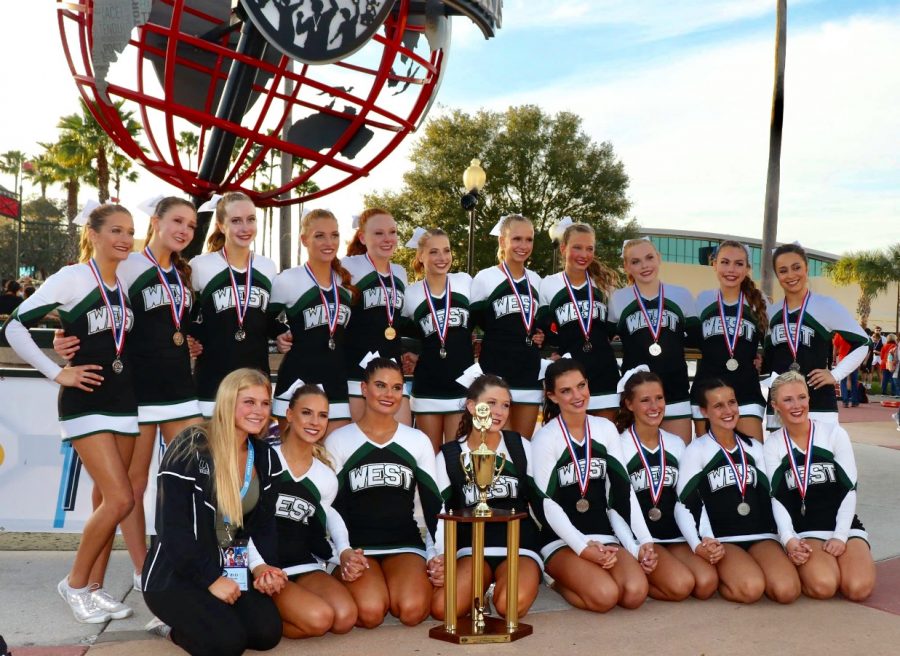 The Varsity Competition team poses infront of the ESPN Arena after winning second place in the Small Non-Building Varsity division.

