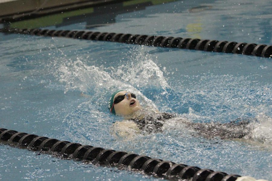 Sydney Hall finishing her backstroke during the annual Metro Swimming Conference