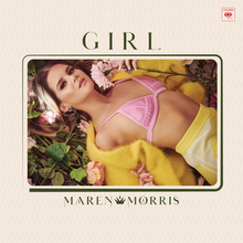 Maren Morris lays out over a bed of flowers for the cover of her new album "Girl."