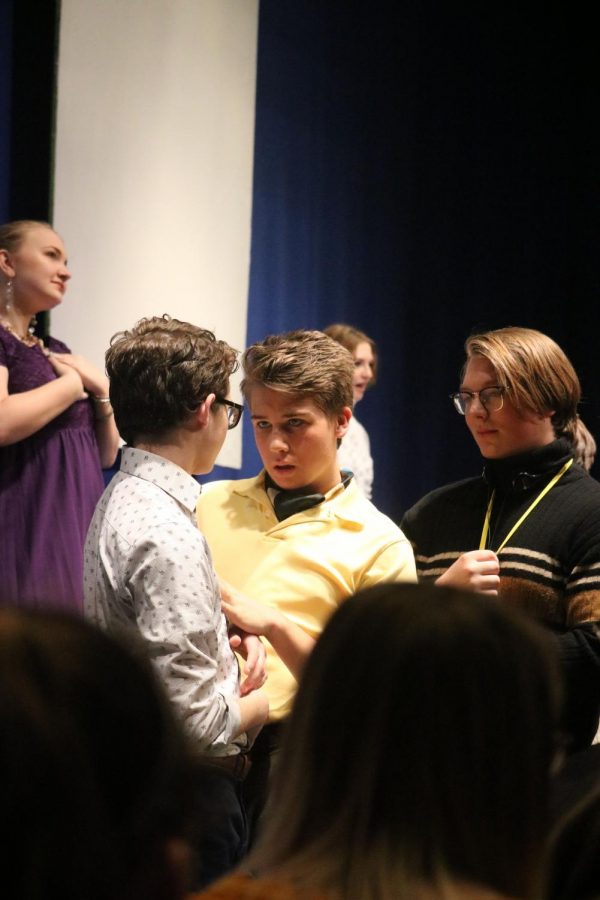 Standing among the audience, sophomore Edison Geiler grabs his scene partners arm. Geiler played a character named Will Willard, a flamboyant young man. “I was really just in the moment,” Geiler said. “I saw the sparkle in my partner’s eyes and I knew the scene was going to be great.”