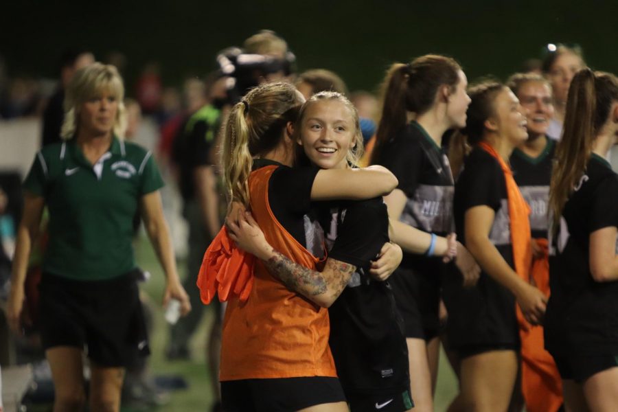 Junior Sierra Schmidt with a celebratory hug during the 4-2 win over Marian. 