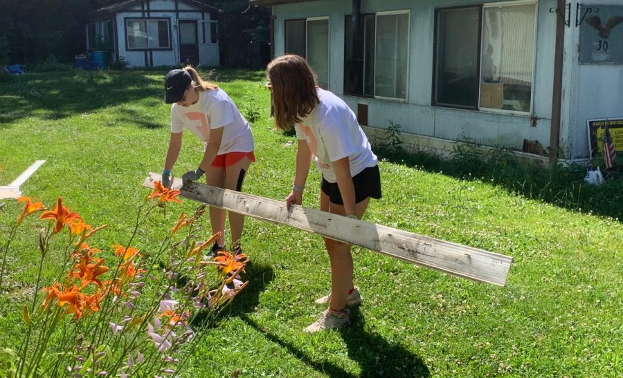 Junior Erica Michel and another volunteer are working hard at building houses for the people in Erie, Pennsylvania. Our residents started crying when they saw their house because they were so shocked that normal kids could come and do this, Micheal said. They were so grateful they made us these nice memory boxes and thanked us several times. 