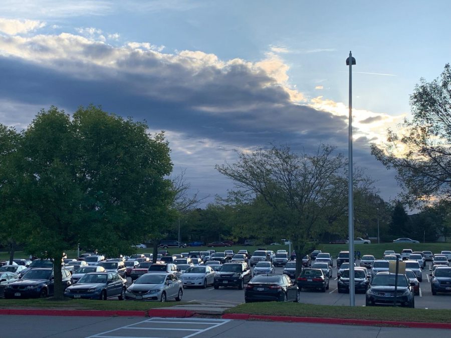 Millard West High School Dirty lot full of cars on an early Thursday morning.