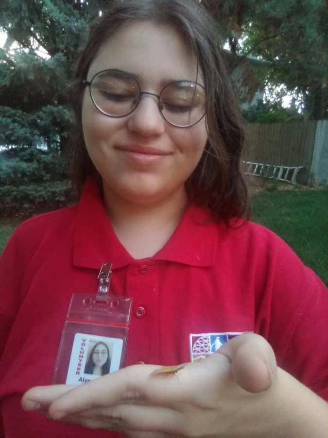 Junior and Zoo Crew member Alyssa Gonzales shows off a tiny moth. I joined zoo crew because I have a passion for the environment, Gonzales said. She plans on continue with Zoo Crew until she ages out of the program.