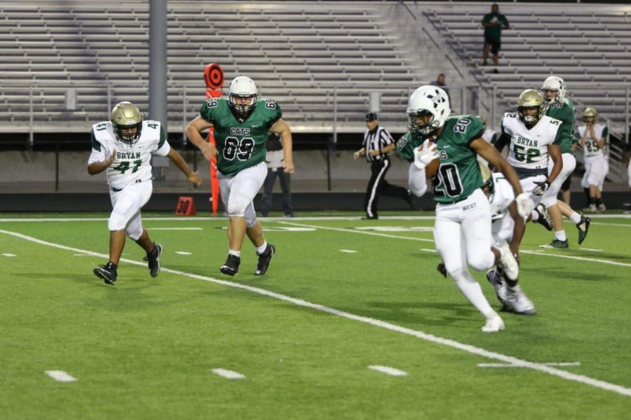 Zach Coleman runs the ball during Thursdays game against Bryan. The Wildcats outscored Bryan 74-6