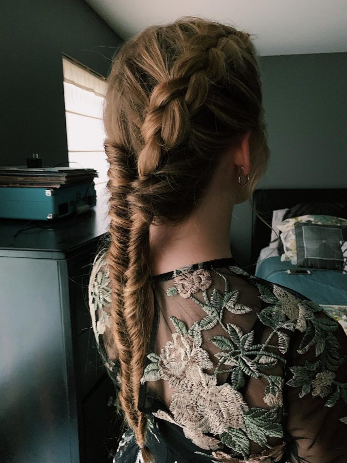 Braiding+quickly%2C+junior+Milina+Mike+does+an+intricate+braid+on+junior+Dakota+Horrocks+for+homecoming.+Mike+and+Horrocks+have+run+a+hair+and+makeup+business+since+February+of+2019.+%E2%80%9CI+am+so+proud+of+what+I+do%2C+and+I+love+when+people+are+happy+with+the+outcome%2C%E2%80%9D+Mike+said.+%E2%80%9CI+love+doing+hair+and+practicing+new+styles+on+people%2C+and+I+plan+on+doing+this+for+my+future+career.%E2%80%9D
