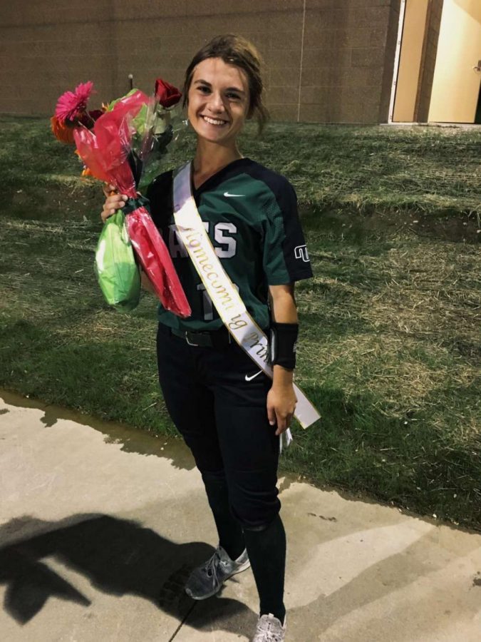 Surprised, junior Delaney Richardson finds out she won Homecoming Princess after her softball game. Her friends and family give her flowers and sash to her which she later on wears on Homecoming night.
