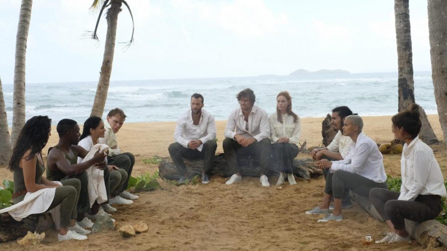 This picture shows the 10 islanders talking about what hey need to do to survive. This happens immediately after they wake up not having any memory or knowing anything about themselves. This scene pulls the viewer in and makes them want to know what is going on, so they keep watching. 
