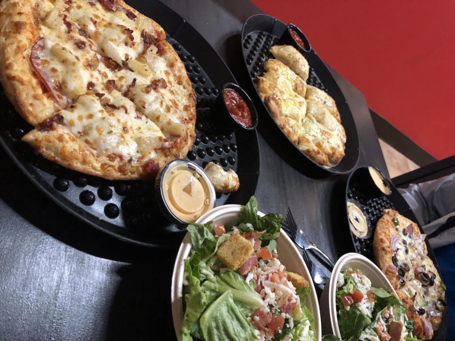 Pizza and cheesy bread along with our salads. The food was amazing and was freshly made with house-made sauces.