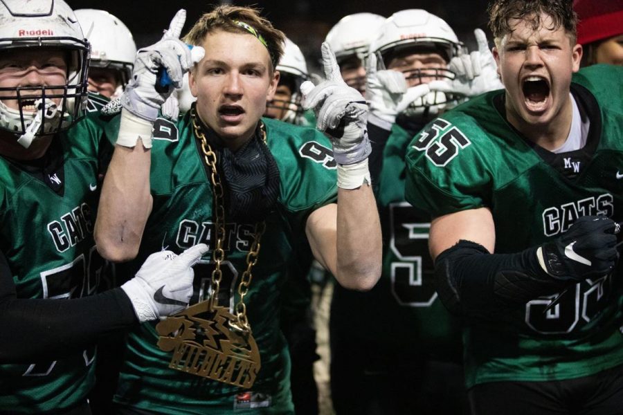 Senior linebacker Nathan Pesek rocks the turnover chain following his electric interception on Elkhorn Souths Elliot Brown.