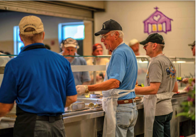 Adults and children alike volunteer their time at the Open Door Mission to help prepare and serve food. The Mission serves over 3,500 meals daily, and this would not be possible without the generous volunteers.
