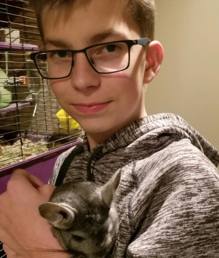 Pictured above is Gavin Christiansen with his unusual pet which is a chinchilla. 