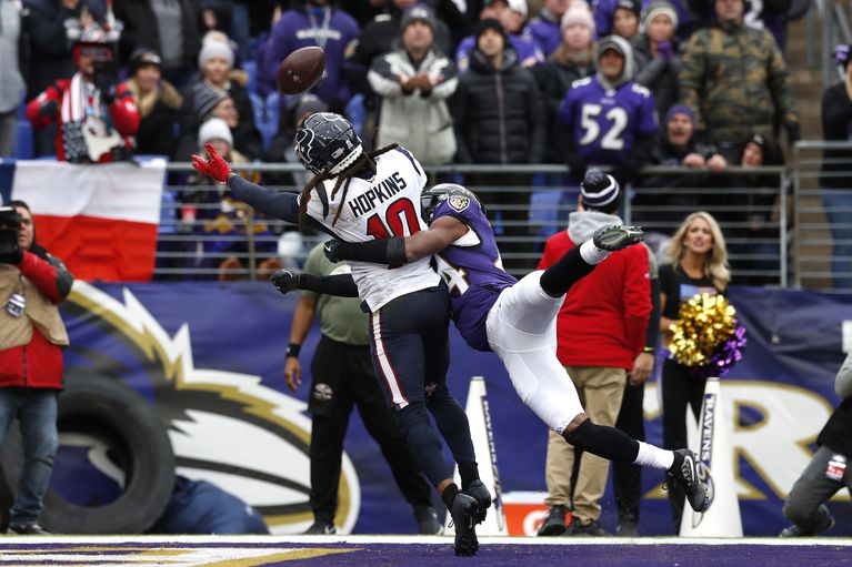 DeAndre Hopkins tries to catch a ball thrown for a touchdown, but is contacted before possession of the ball.