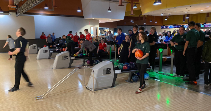 Bowen is pictured getting ready for her next turn to bowl in a meet. The team is behind her, cheering her on and hoping she does well.