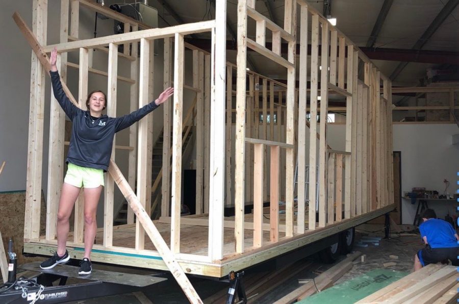 While working on the frame of the house, junior Elise Nyffeler poses for a photo. The Nyffelers finished building their tiny house in November of 2019, a project they started in the Spring of 2018. “My family and I have enjoyed hanging out together in our tiny house, and sitting down with friends and playing games inside,” Nyffeler said. “I am excited for future memories we will make in it.”
