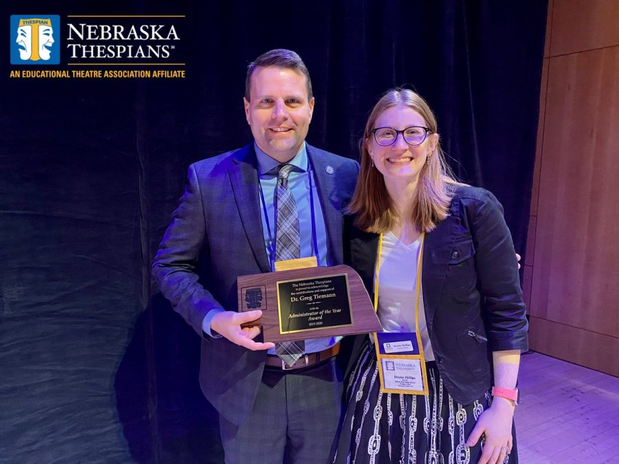 Principal Greg Tiemann and drama director Brooke Phillips side by side accepting Dr. Tiemanns administrator of the year award at the annual thespian festival. 