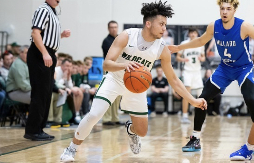 Junior Dominic Humm tries to make a play on Millard North junior Jadin Johnson. Dominic Humm has been a main scorer for the Wildcats this season, and hopes to ramp up his play even more come districts. “We’re hoping we can make a run,” said Humm. “We just have to give all our effort and we can beat anyone.”