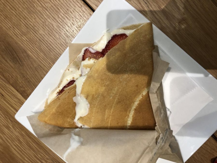 Strawberry Cheescake crepe. Filled with cheesecake filling, fresh strawberries plump and juicy and graham crackers. 