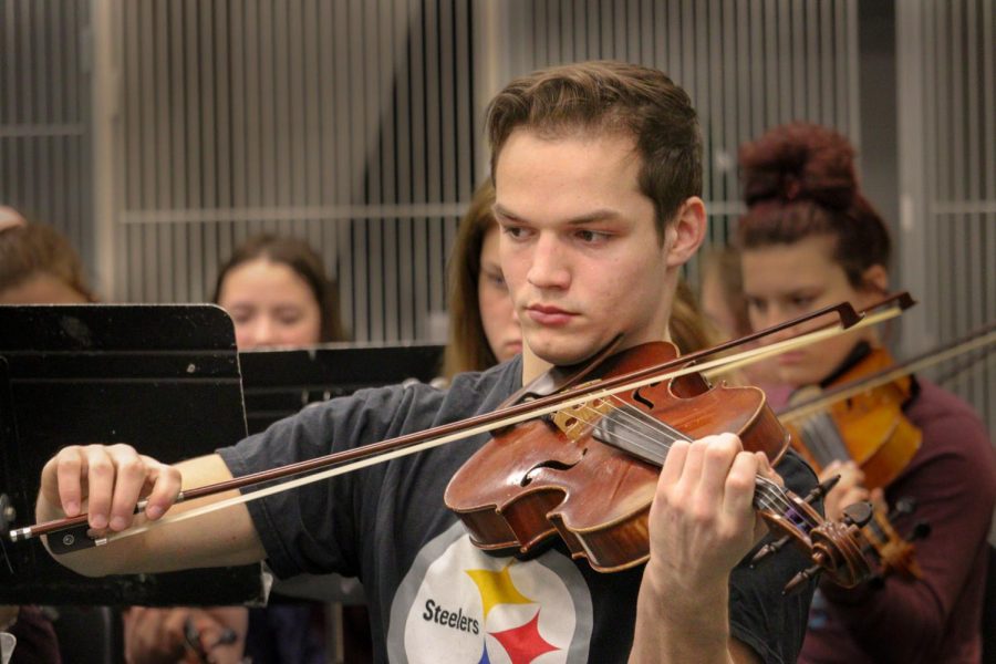 Senior Ethan Valencia plays his viola during orchestra class. Valencia hopes to attend college on a music scholarship. “What I learned from doing all these activities is that hard work and dedication defeats all.”