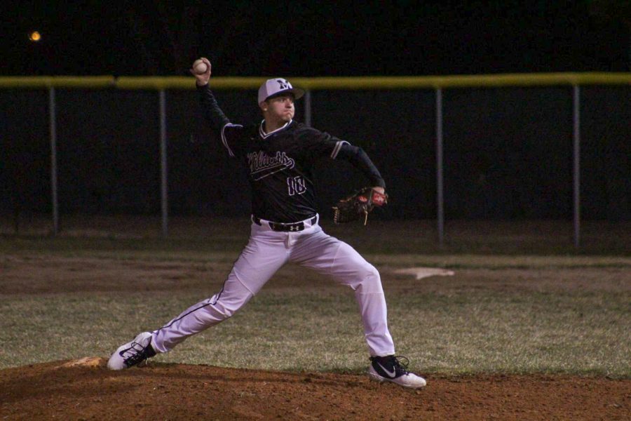 Senior Seth Claybourne pitching a ball at one of his games in the 2019-2020 school year.