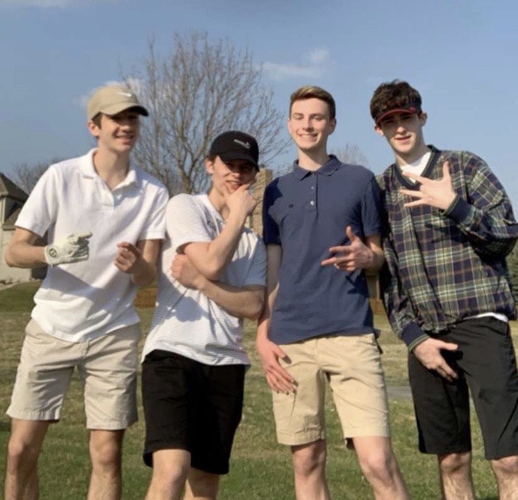 Four+sophomores+Mitchell+Baird%2C+Jack+Byers%2C+Luke+Hudek+and+Aidan+MacLeod+all+pose+for+a+photo+after+golfing+the+front+nine+holes+at+Eagle+Run.+%E2%80%9CIt+was+just+great+to+be+able+to+hang+with+my+friends+during+this%2C%E2%80%9D+Hudek+said.+%E2%80%9CI+didn%E2%80%99t+think+we%E2%80%99d+be+able+to+all+do+it+together%2C+but+we+did%2C+and+it+was+totally+worth+it.%E2%80%9D