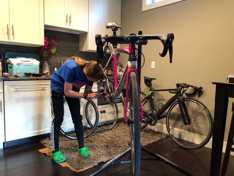 Sophomore Emmi Gilbert works to repair her gravel bike. She has been working towards becoming a bike mechanic and has been learning to repair while in quarantine. Gilbert hopes to soon turn her passion for cycling into business repairing bikes for people in Omaha. 
