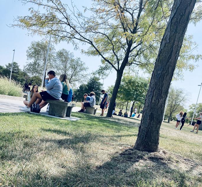 This is the front of Millard West High school where they have now opened for lunch. In this photo you can see many students enjoying eating outside. Outside dining is important and should continue to be in place. Students seem to be happier, less stressed and are enjoying the nice weather. 

