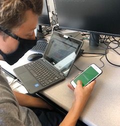 Junior Joseph Ebmeier opens the synergy app in his advanced Journalism class. He is looking to access his academic records to see his GPA. "Synergy is a great app but quite the change from infinite campus. I like a lot of the new features and apps it has, and how its set up."