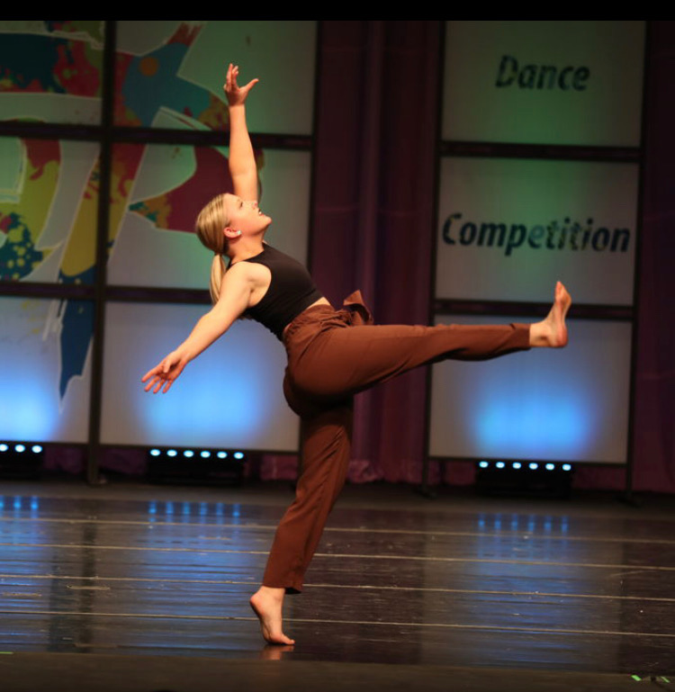 Senior Vivien Gaines performs for judges at a local dance competition. “My style of dancing is mostly based around musicality and how I can portray the music with the movement,” Gaines said. “I’m a big fan of using music that isn’t traditionally used and playing around with how I can change the way the music is perceived with dancing.”