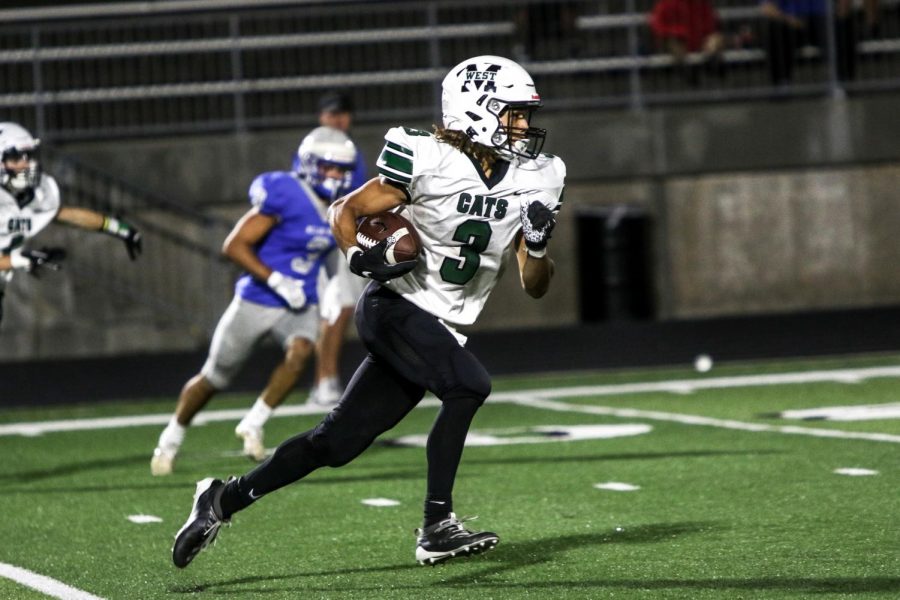 Senior safety Kaden Williams returns a punt from the 43 yard line. Millard West was taking on Millard North and won 21-14. 