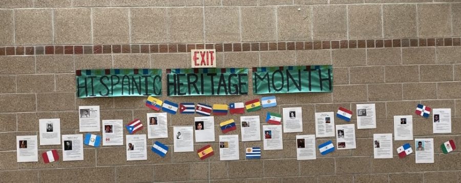 The+wall+in+front+of+the+library+honors+Hispanics+throughout+history.+Many+different+Latinos%2Fas+are+displayed+along+with+their+stories+and+accomplishments.+%E2%80%9CAs+a+Latina%2C+when+creating+the+posters+of+important+people+for+Hispanic+and+Latino+Americans%2C+I+found+it+to+help+me+better+my+sense+of+connection+to+my+community%2C%E2%80%9D+senior+Delaney+Akins+said.%E2%80%9DWhile+researching%2C+I+found+figures+who+helped+stand+up+to+racial+injustices+and+overall+help+progress+American+society+forward.%E2%80%9D%0A