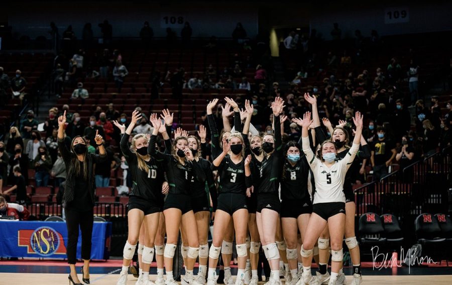 Millard+West+volleyball+players+waving+to+the+crowd+after+their+thrilling+five+set+victory+over+Lincoln+Pius.+There+were+500+tickets+allowed+for+each+team+in+the+state+tournament.+%E2%80%9CIt+really+just+added+fuel+to+our+fire%2C%E2%80%9D+junior+Maddie+Mactaggart+said.+%E2%80%9CIt+was+super+exciting+to+hear+the+crowd+go+crazy+when+we+scored+a+point+and+really+helped+keep+the+momentum+going.%E2%80%9D