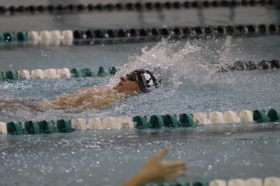 Senior Dylan Fucik swims the 100 backstroke at time trials. Last season, he was a part of the record breaking 400 Freestyle Relay team. “I am mainly looking forward to competing again,” Fucik said. “We haven’t competed for eight months so jumping in and competing with other teams is what I’m most excited about.”