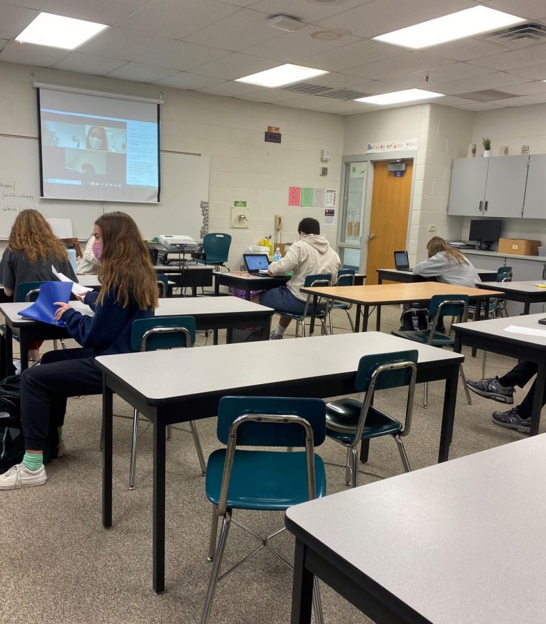 Some students sit, socially distanced, in a public school classroom while others appear on Zoom. As Secretary of Education Betsy DeVos refuses to attend discussions about school reopenings, students and teachers are adapting and showing resilience. 