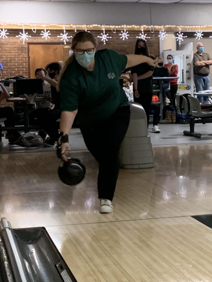 Senior Kaitlyn Dickmeyer rolls the ball down the lane. She thinks that she needs to improve on some of her skills. “The skill that I would like to improve for the next meet is to keep my elbow in,” senior Kaitlyn Dickmeyer said. “I need to make sure that I dont top the ball which is when you twist your wrist too much which will cause it to go more towards the left.”
