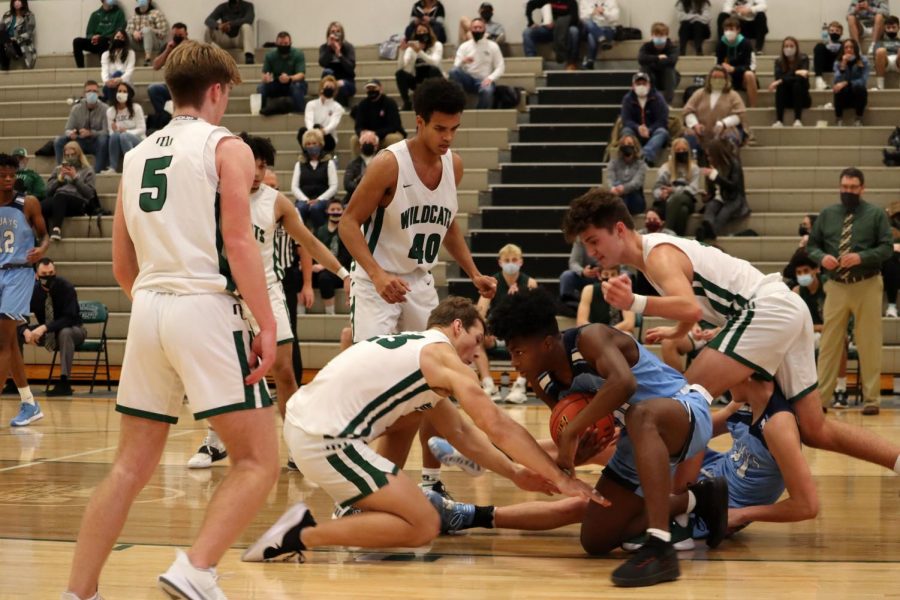 Multiple Millard West players scrambled for a loose ball in their 42-40 loss against Creighton Prep. The play summed up the game, as it was a slugfest from the start. The Junior Jays only shot 34% from the floor, while the Wildcats only took half as many shots as Prep.