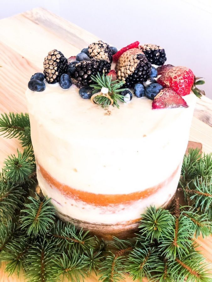 This+tiered+cake+is+bursting+with+flavor+and+pizzaz+from+it%E2%80%99s+lovely+vanilla+cake+to+its+cream+cheese+frosting+and+gold-dusted+berries.+Friend+and+customer+Valerie+Pioppi+is+proud+of+Olivia+and+her+baking+business.+%E2%80%9CI+show+all+my+friends+her+cakes%2C+and+I+think+it+really+displays+her+work+ethic%2C%E2%80%9D+Pioppi+said.+%E2%80%9CI+would+definitely+get+a+cake+from+her+because+the+way+she+decorates+them+is+so+pretty.%E2%80%9D