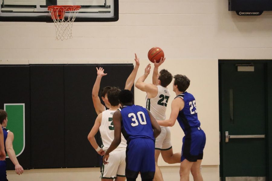 Senior James Conway going up for a tough shot in the paint against Papillion La Vista South. Conway finished the night with 10 points and nine rebounds. “We were able to play at our pace for the majority of the game,” Conway said. “We kept the lead by staying cool and relaxed.”