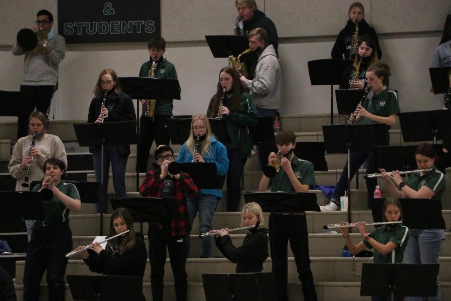 Pep band performing in the bleachers for a basketball game. Many of these students being seniors, they are enjoying their last year playing for the school. 
“Even when we werent sure if we were ever going to perform our show or have any concerts, though, we still supported our classmates,” senior Natalie Jaworski said. “I think thats the big takeaway of what weve been doing this year: even though things arent the same, theyre still really special, because at every level, from students to parents to staff, we want them to be special.”

