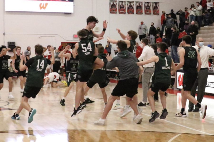 Millard West celebrates after their 55-54 win over Westside. They play Lincoln Pius X in the state tournament on March 9. “It felt like I was on cloud nine for the night,” junior Chase Hultman said. “Celebrating with all of the guys and our friends in the student section was a lot of fun and knowing that we would get a chance to play in Lincoln is really cool, but we still have to approach it as any other game so that we can keep playing in Lincoln instead of being one and done.”