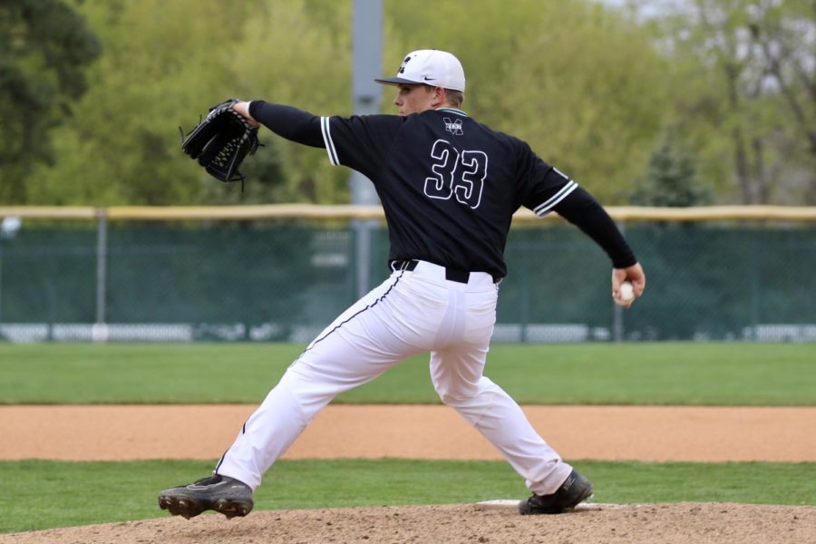 Senior+Kael+Dumont+pitching+in+the+5-2+victory+against+Millard+South+in+the+second+round+of+the+Metro+Tournament.+He+pitched+all+seven+innings%2C+only+allowing+the+Patriots+to+score+a+total+of+two+runs.+%E2%80%9CIt+felt+like+we+were+finally+clicking+as+a+team%2C%E2%80%9D+Dumont+said.+%E2%80%9CThe+week+before+we+went+0-4%2C+so+coming+out+and+beating+them+on+Tuesday+and+then+again+on+Thursday+really+helped+us+gel+together.%E2%80%9D